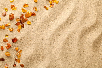 Sand Background With Scattered Ambers