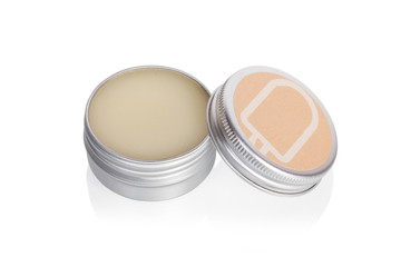 Lip balm in metallic tins isolated on a white background - 325831215