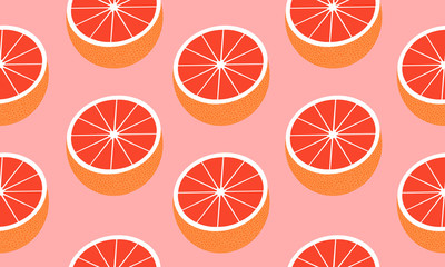 Seamless background with halves red grapefruit. Vector fruit design for pattern or template.