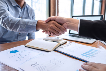 Finishing up a meeting collaboration, Handshake of two business people collaboration after contract agreement to become a partner of business making to successful and growth profit