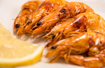 fried prawns on plate and slice of lemon