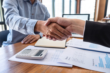 Finishing up a meeting collaboration, Handshake of two business people collaboration after contract agreement to become a partner of business making to successful and growth profit