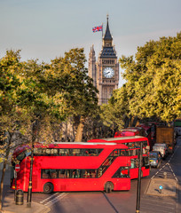 Big Ben with red buses in London, England, UK