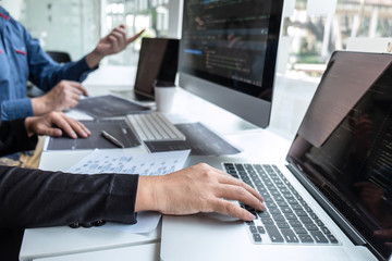 Team of developer programmer working on project in software development computer in IT company office, Writing codes and data code website and coding database technologies to find problem solution