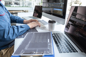 Developer programmer working on project in software development computer in IT company office,...