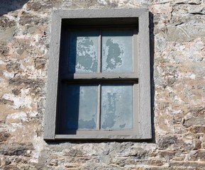 A close view of the old window frames on the building.