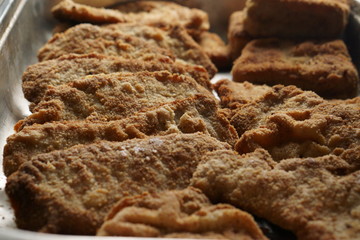 breaded pork schnitzel in a gastronorm pan container