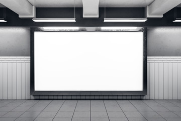 Blank subway poster on white wall.