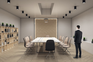 businessman standing in modern meeting interior hall