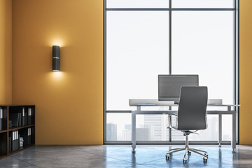 Yellow office interior with computer on table