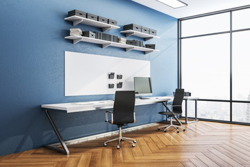 Modern blue workplace with сomputer on table