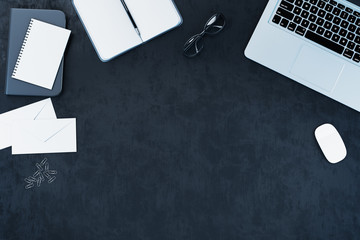 Top view laptop, notepad and other accessories on office desk