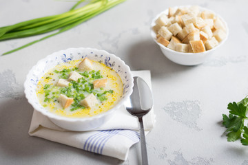 creamy potato soup with croutons and fresh herbs