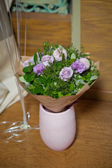 Pink peonies .Bouquet of flowers Purple in paper . Paper bouquet of fresh pink , purple roses . Pink flower in vase . Flowers delivery.