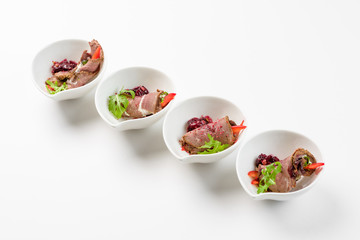 Meat loafers with salad on a white background