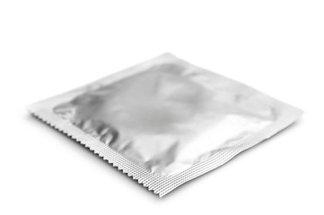 Condom in pack isolated on white.