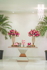 cake table decorated with flowers for wedding