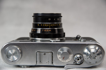 old camera with lens on a white background