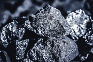 Coal miner in the man hands of coal background. Coal mining
