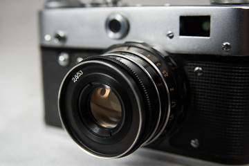 old camera with lens on a white background