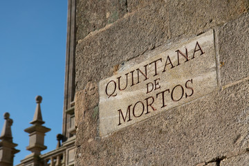 Fototapeta premium Quintana de Mortos sign on Santiago de Compostela Cathedral. Quintana square