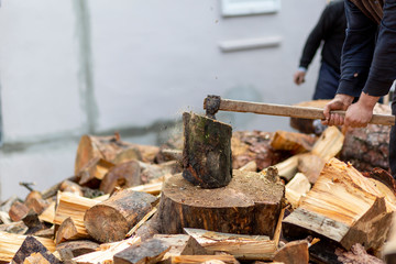 Woodcutters who break wood with an axe
