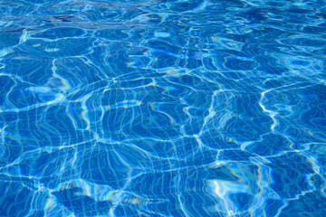 Blue water in the pool in sunny