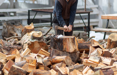 Woodcutters who break wood with an axe