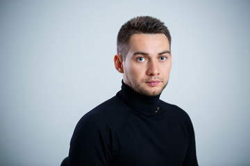 Obraz premium young businessman in black golf and jeans