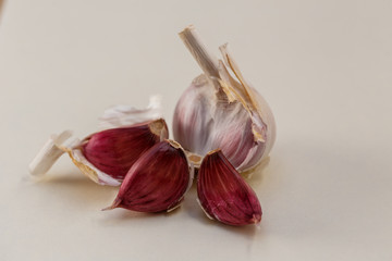 White and purple fresh garlic peeled cloves.