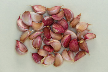 White and purple fresh garlic peeled cloves.