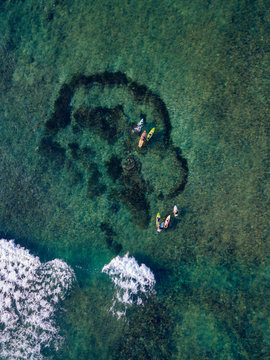 Aerial view of surfers in the ocean