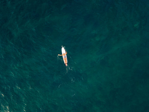Aerial view of female surfer