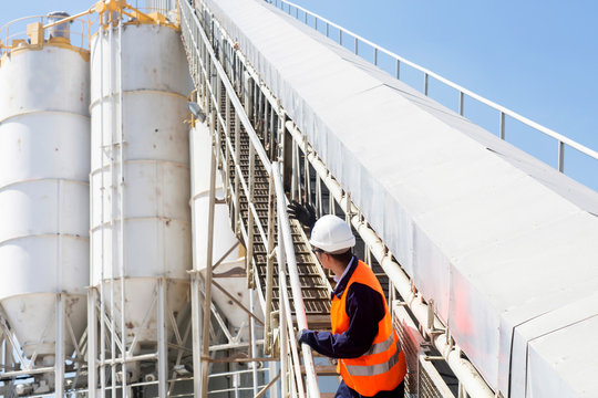 concrete worker with helmet in concrete plant
