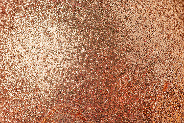 Shiny red-gold background. Small sparkles close-up. The basis for sites and layouts.
