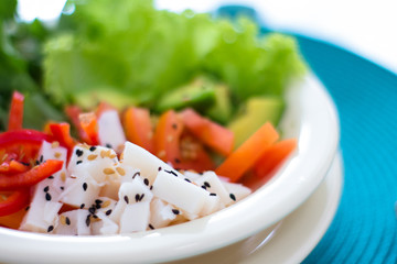 Salad plate with tomato lettuce palm heart and avocado