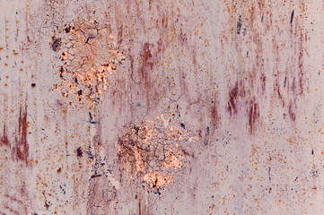 Old painted sheet of metal with cracked paint and rust gray beige peach terracotta blue pink