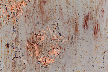 Old painted sheet of metal with cracked paint and rust gray beige peach terracotta blue
