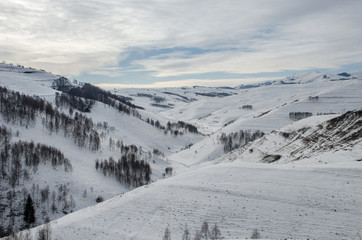 Traditional houses in Dumesti village, Apuseni Mountains, Romania, in winter