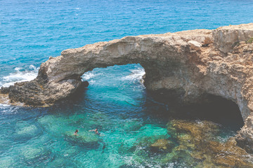 Natural Rock Bridge at Cape Greco near Ayia Napa in the evening light. Cyprus