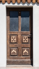 Traditional wooden door in the Ore mountains region, well known for the craft of wood carving