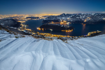 the snow over Iseo lake from summit of Punta Almana