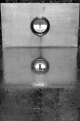 Street scene reflected in rain water