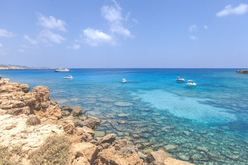 Fototapeta na wymiar Seascape with azure sea and rocks, Ayia Napa Blue lagoon
