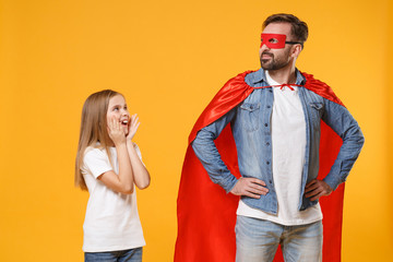 Bearded man in casual clothes Superman costume with amazed child baby girl. Father little kid...