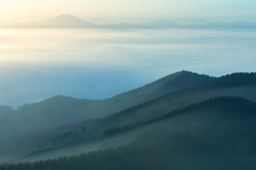 Misty mountains at sunset in the basque country, spain