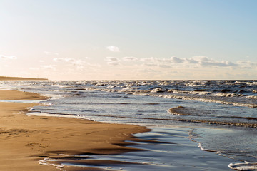 Foamy waves on the Baltic coast in Latvia