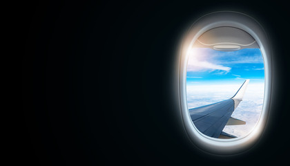 Black background with copy space with look of window frame of airplane flight see view of sunset clouds, airplane wing, ice mountains for luxury trip tourism travel transportation concept