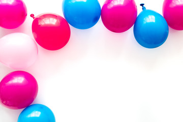 Colorful balloons frame on white background top-down frame copy space