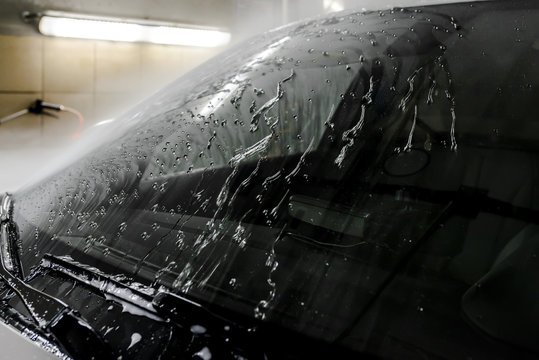 The Surface Protection Of The Car Windows At The Car Wash Under The Jets Of Water